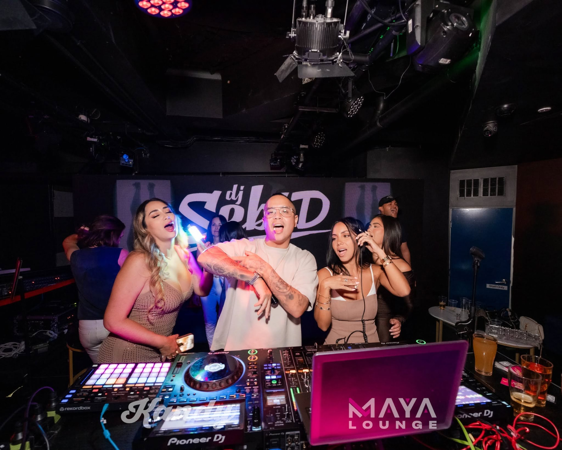 Friends singing along in the Kandy DJ booth